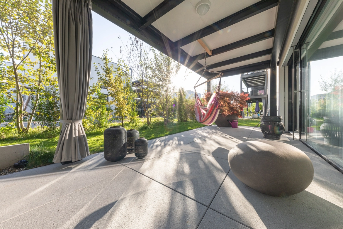 Residential development in Switzerland with terrace slabs in sunny weather.