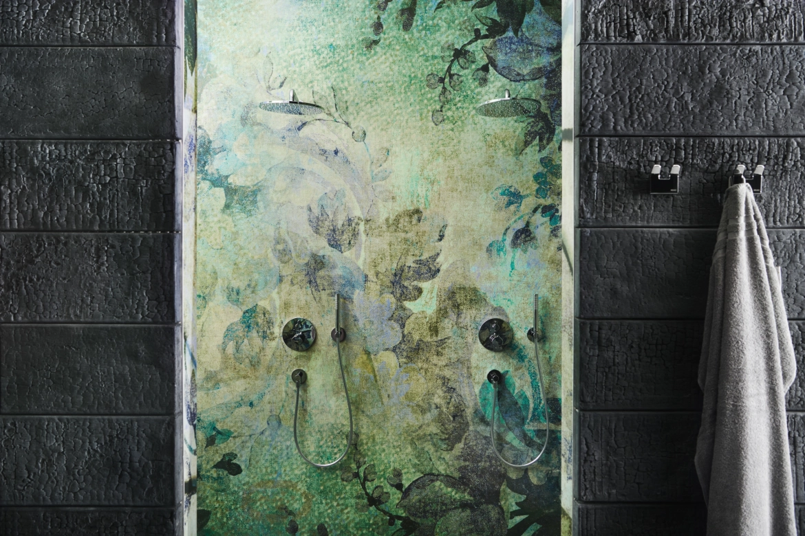 View of the shower, which has a floral design and is framed by SHOU SUGI BAN.