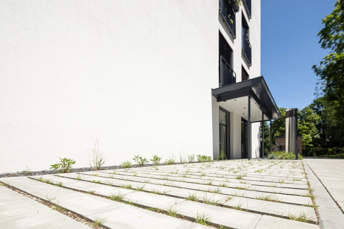 Entrance area with green paving stones