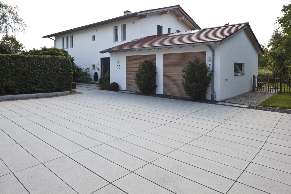 elongated paving stones for a modern house with a double garage 