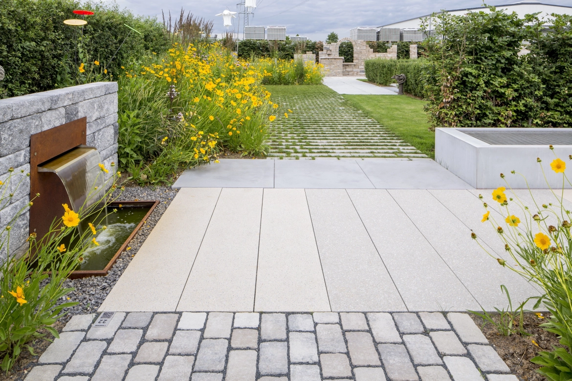 Natural garden with various paving stones and terrace slabs in the idea garden.