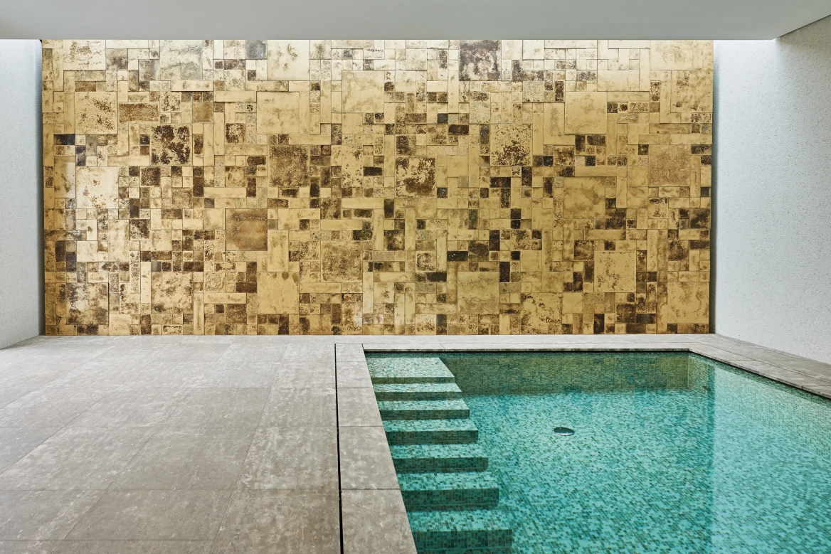 Swimming pool with concrete design tiles