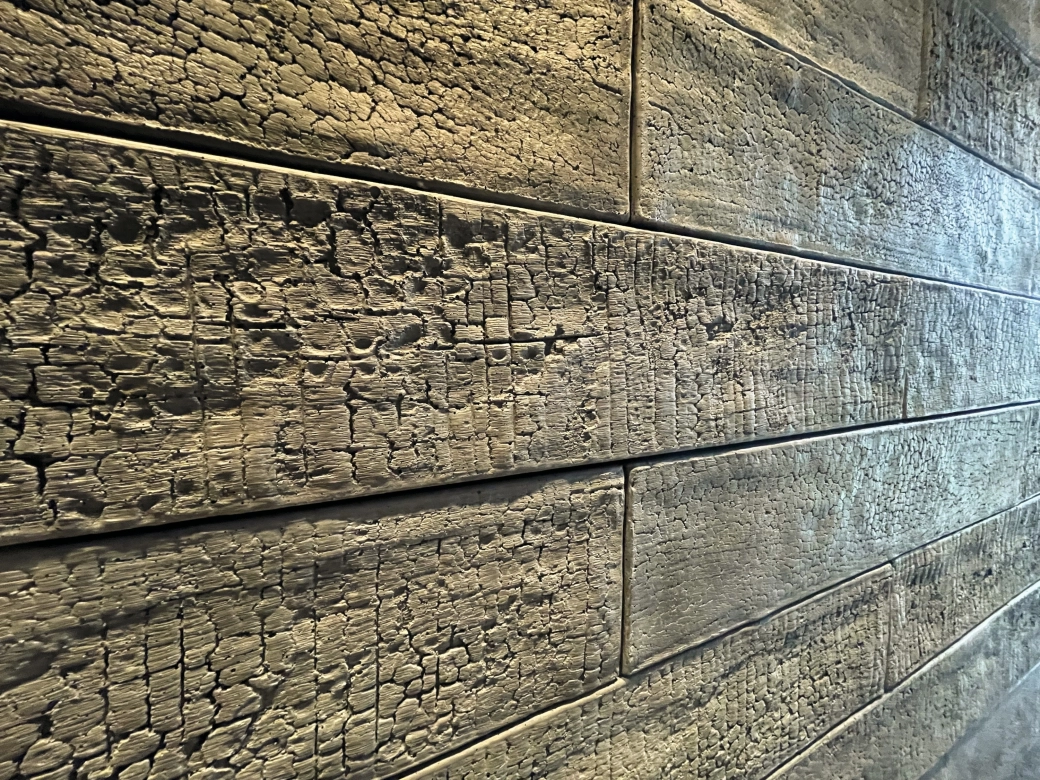 After shot of the architectural concrete tiles in the Shou Sugi Ban look.
