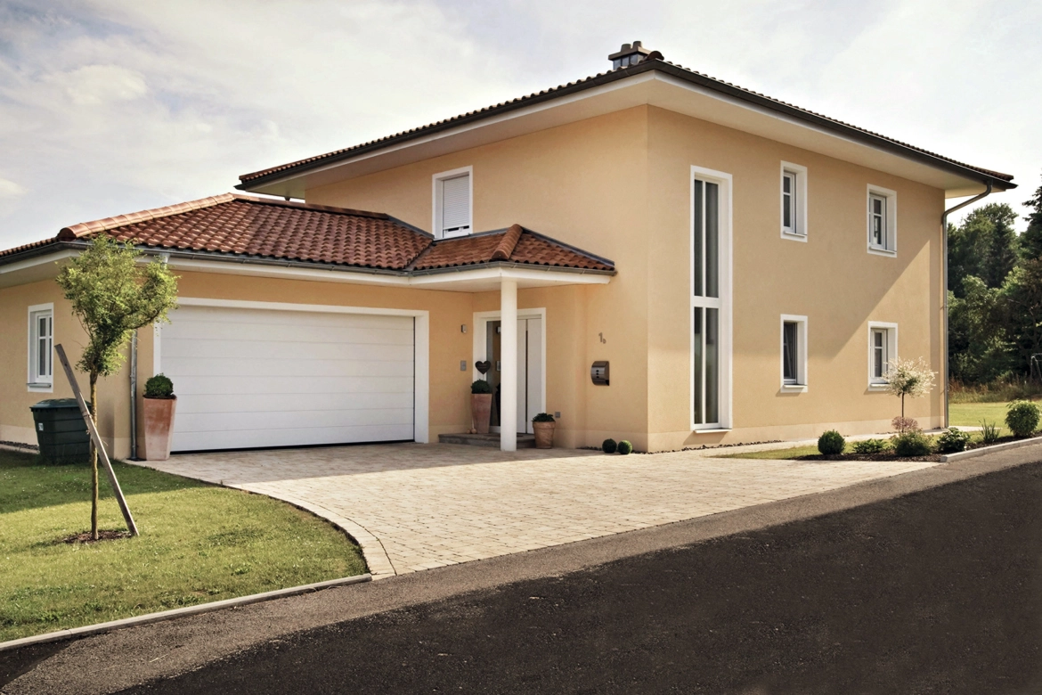 Mediterranean house with brown-beige nuanced paving