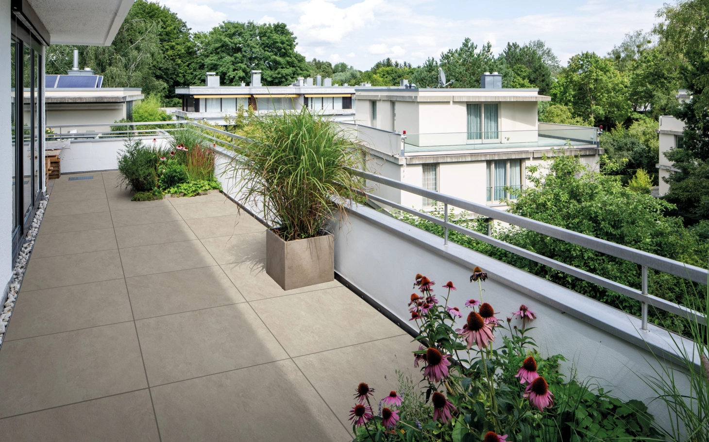 Roof terrace with the GDM.LIVA twice ceramic composite slab in medium limestone