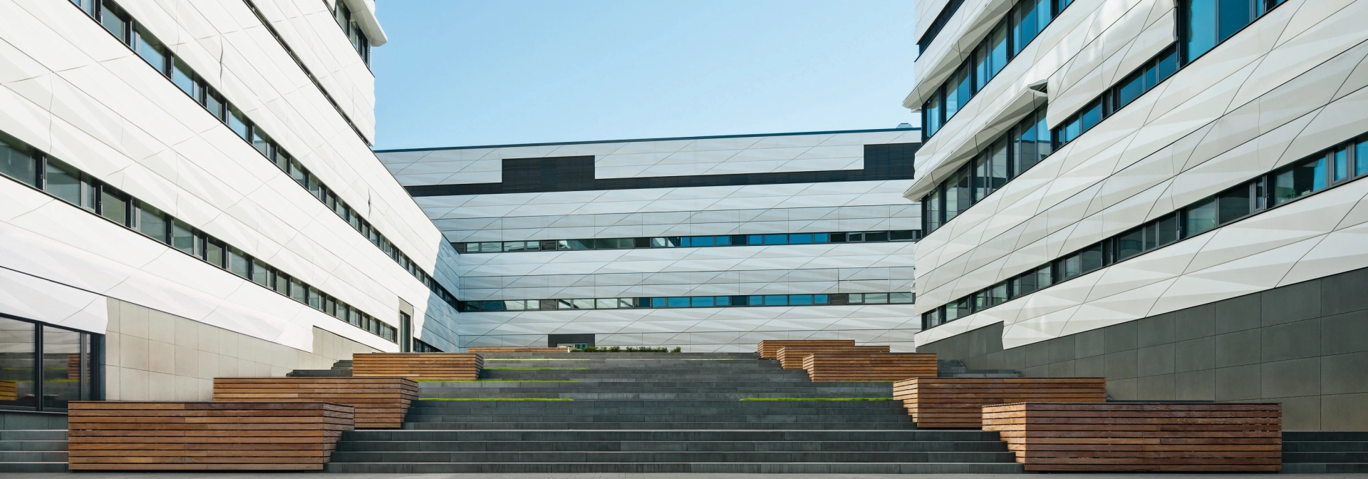 Spacious staircase between two bright modern buildings