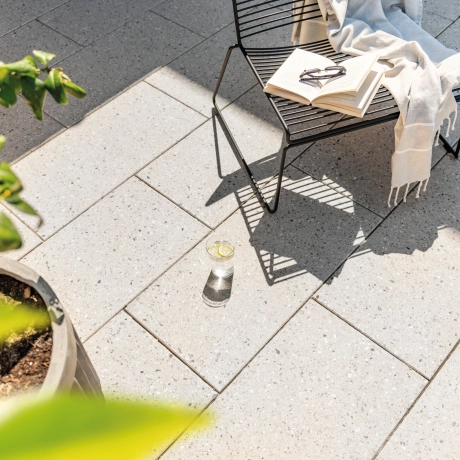 Chair with book and food on a terrace