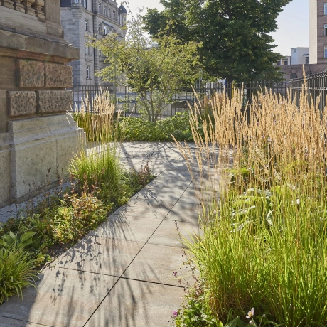 Large-format path around a private house in the city.