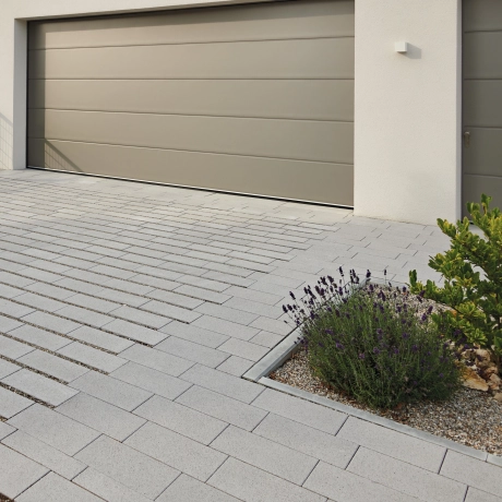 Driveway of a detached house with a double garage.