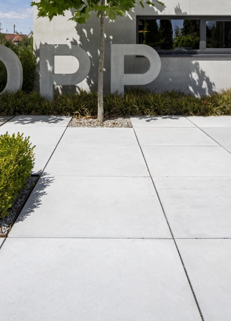 exposed concrete company central square entrance