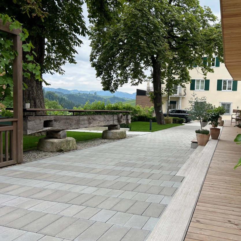 Long driveway to a farmhouse with Tetrago stone paving