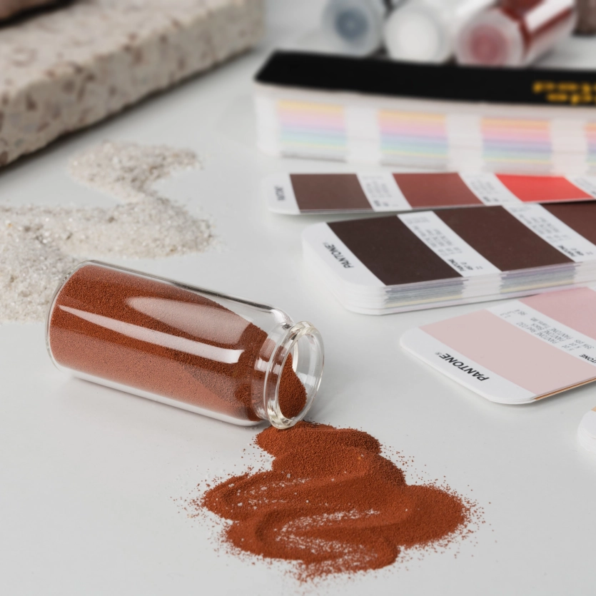 Moodboard with red color pigments in a bottle and a pantone fan