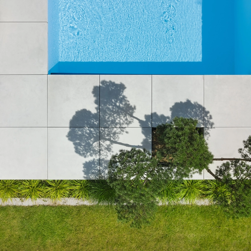 Bird's eye view of an open space with pool surround.