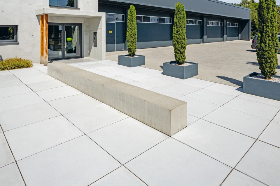 exposed concrete company central square entrance
