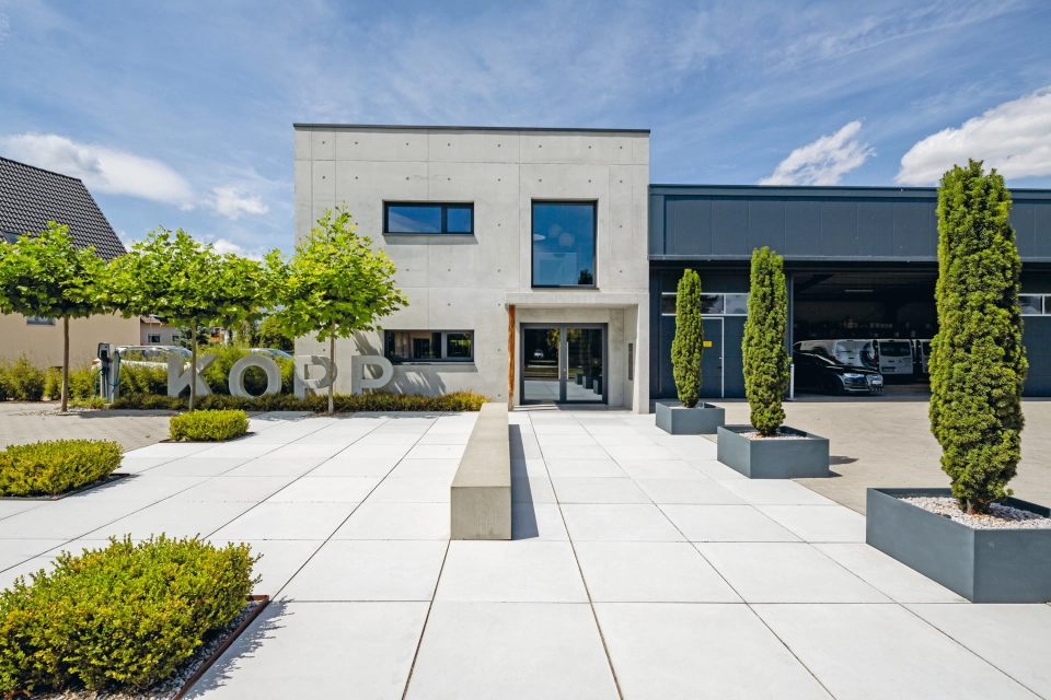 exposed concrete company central square entrance